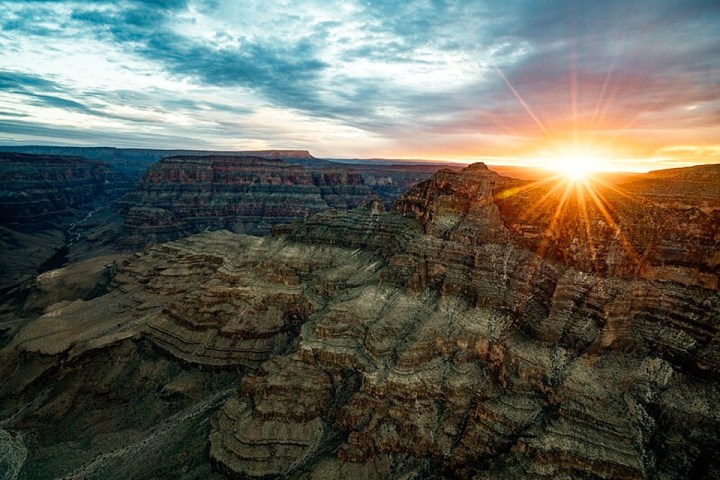 a canyon with a sunset in the background