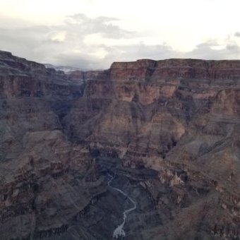a canyon with a mountain in the background