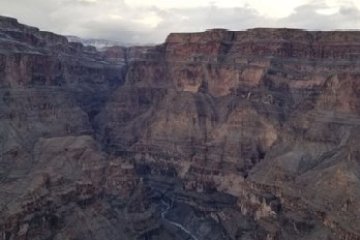 a canyon with a mountain in the background