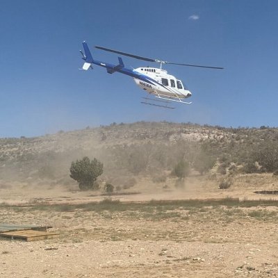 a helicopter that is flying in the air