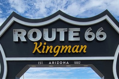 Route 66 Kingman sign with blue sky background.