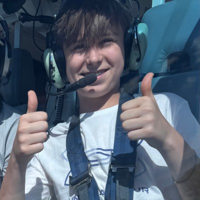 a close up of a person talking on a cell phone